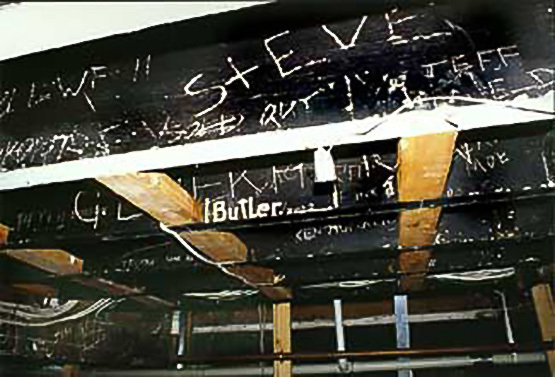 Graffiti on the rafters of the Stage Door basement club, Hereford Lane, Christchurch, including 'Clapton is God'