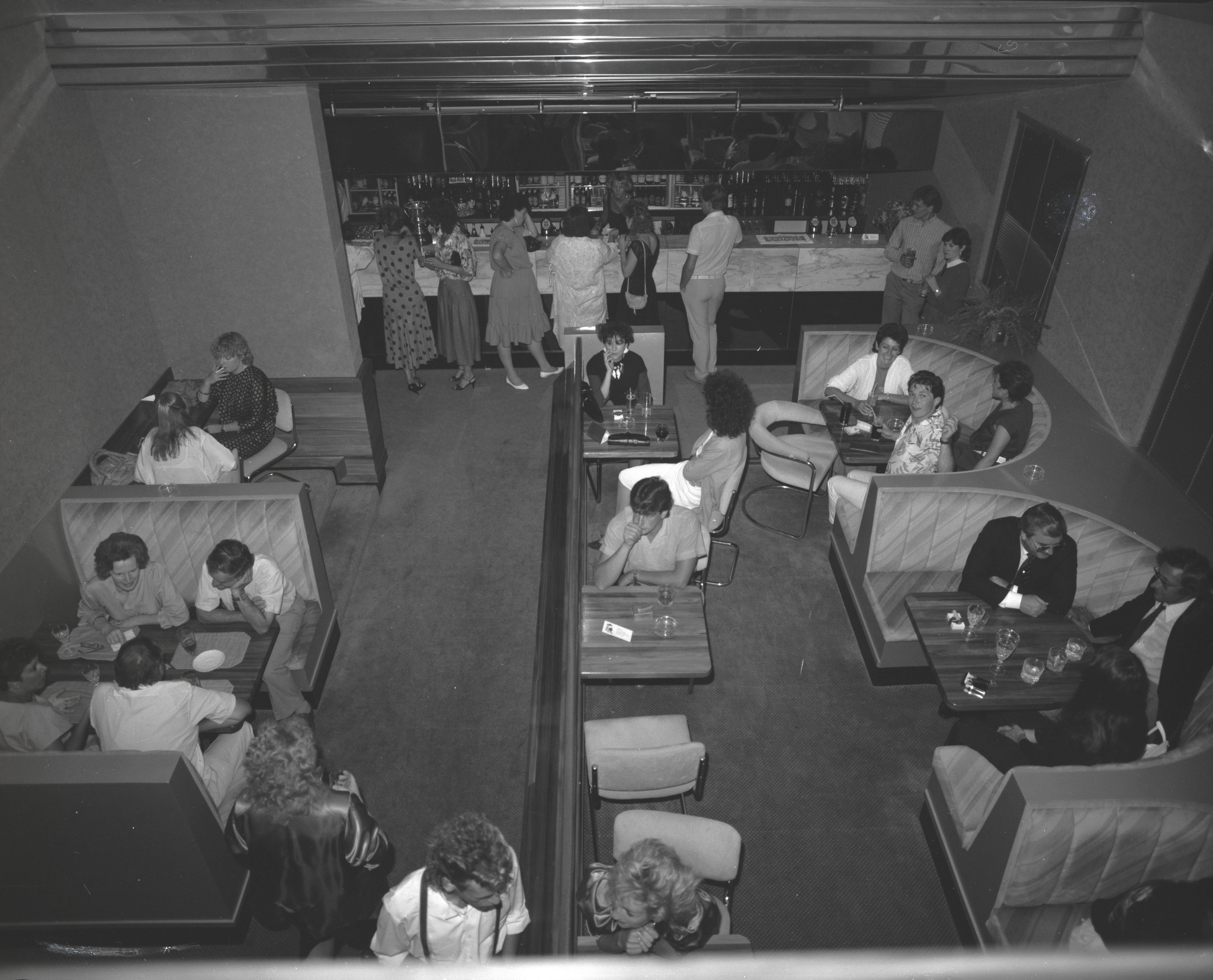Overhead view of the Firehouse Nightclub on a busy night, showing patrons in booth seating and at the bar, Christchurch