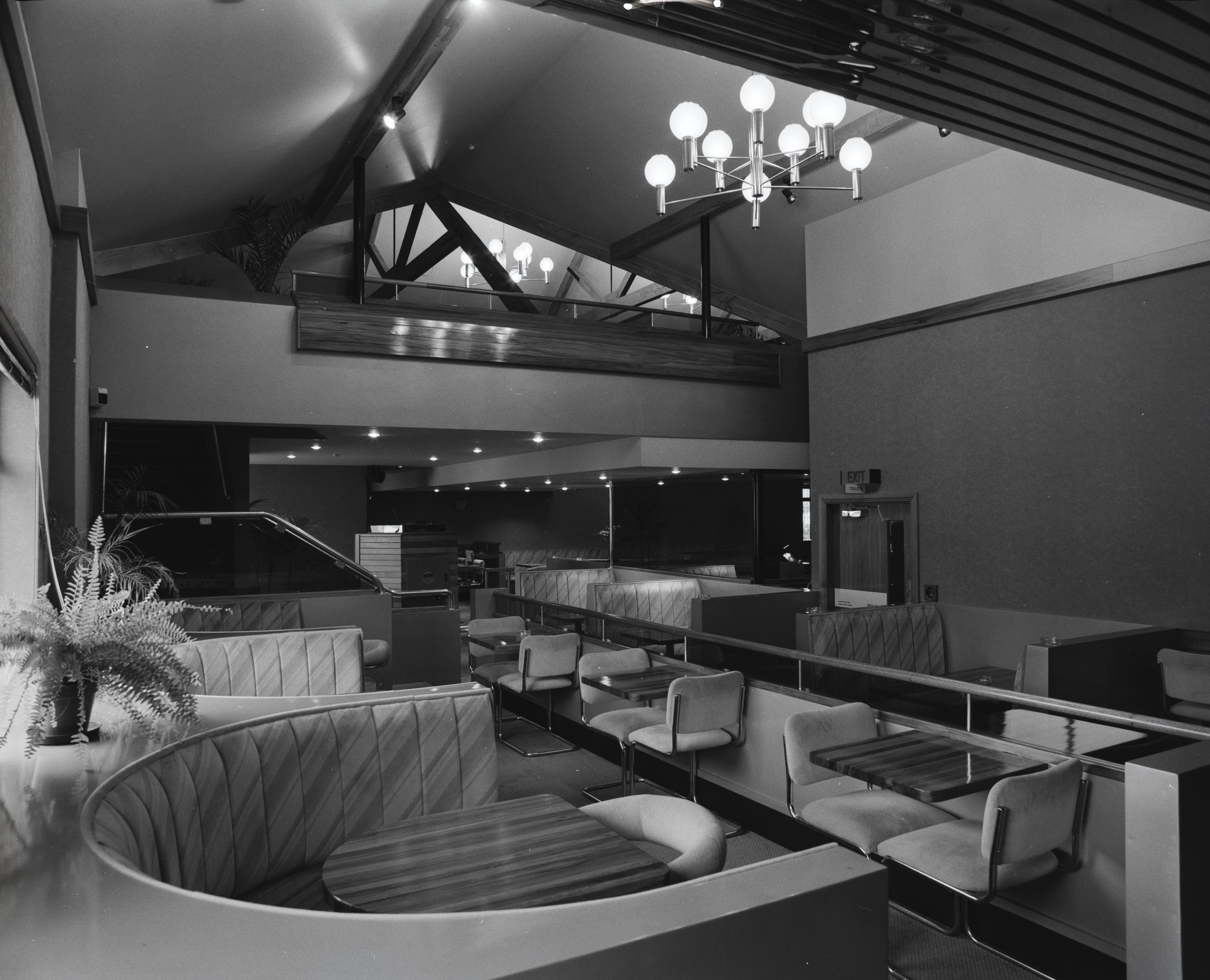 The marble bar counter at the Firehouse Nightclub, Christchurch, with mirrored ceiling and patrons being served